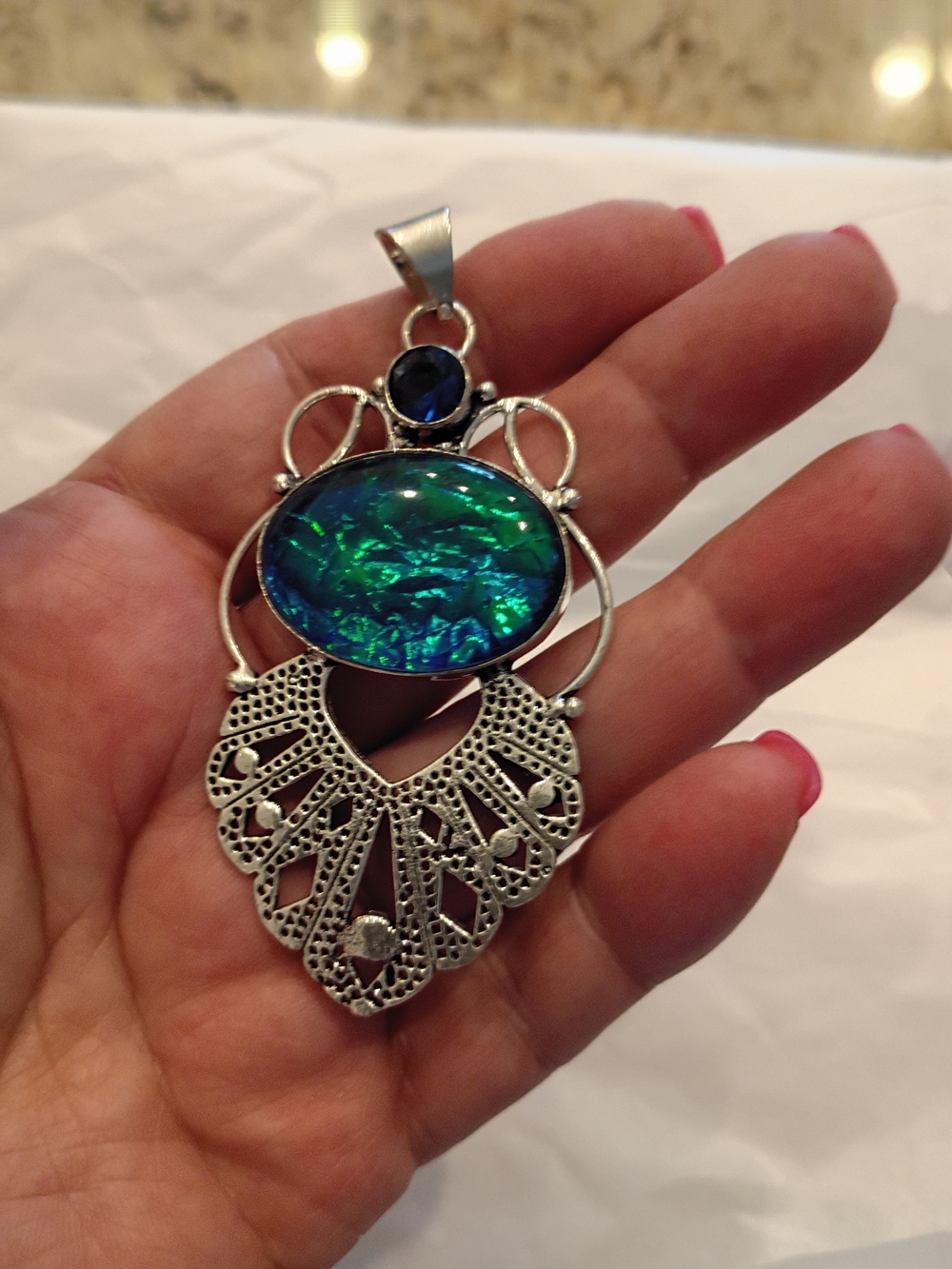 Silver Filigree Pendant with Blue-Green Opal Center And Blue Sapphire Stone